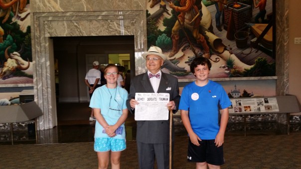 With Harry and the Chicago paper that reads "Dewey Defeats Truman."